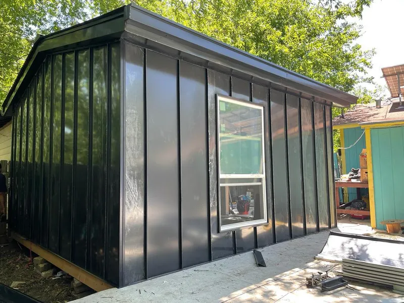 Black standing seam metal wall panels for Roof Inspection in Robstown