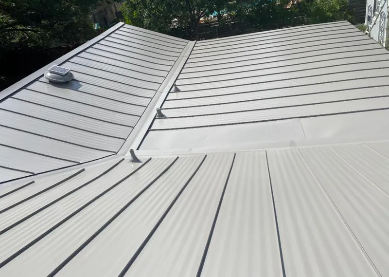 Solar attic fan installed on a metal roof for Roof Ventilation in Robstown